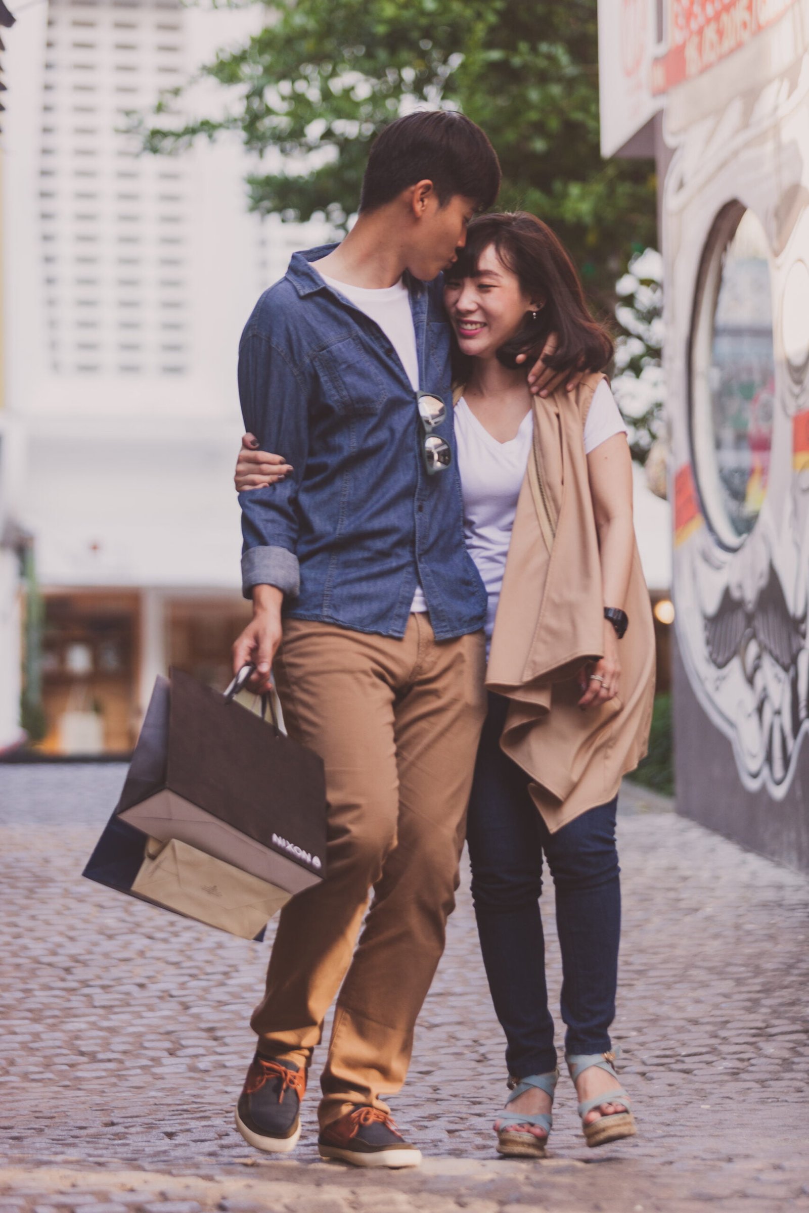 loving-couple-strolling-with-shopping-bags